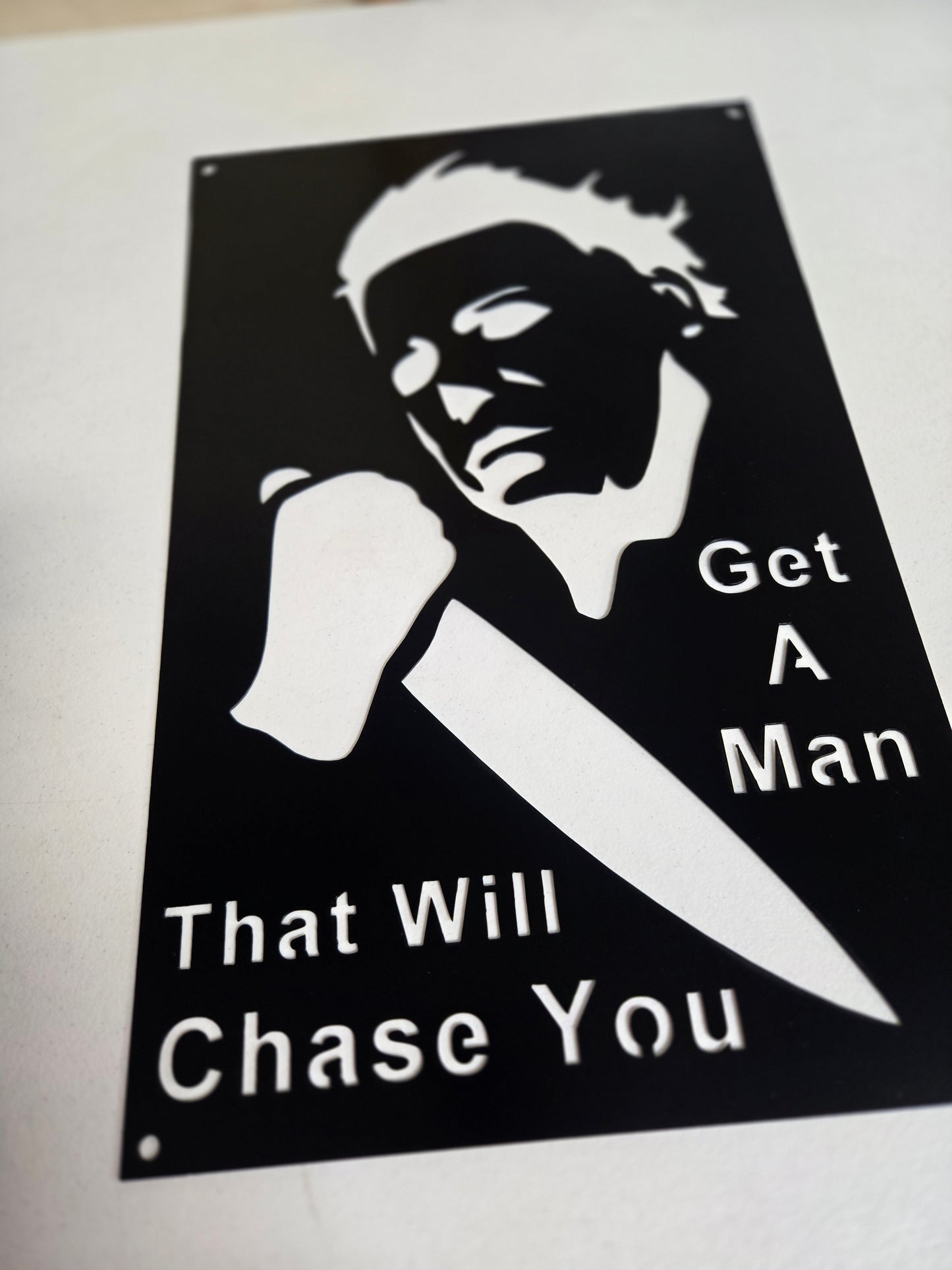"Get a Man That Will Chase You" – Horror-Inspired Metal Wall Sign with Knife Silhouette