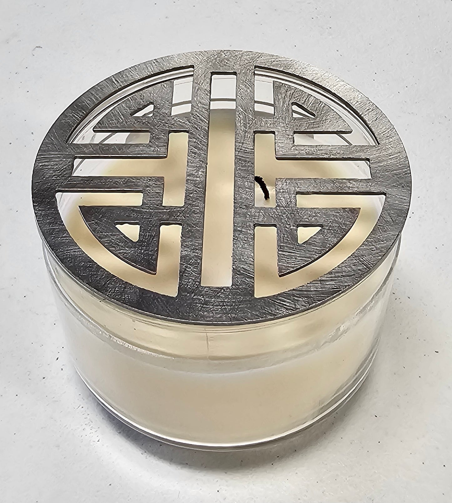 Double Happiness Glow candle topper in black ceramic finish on a candle