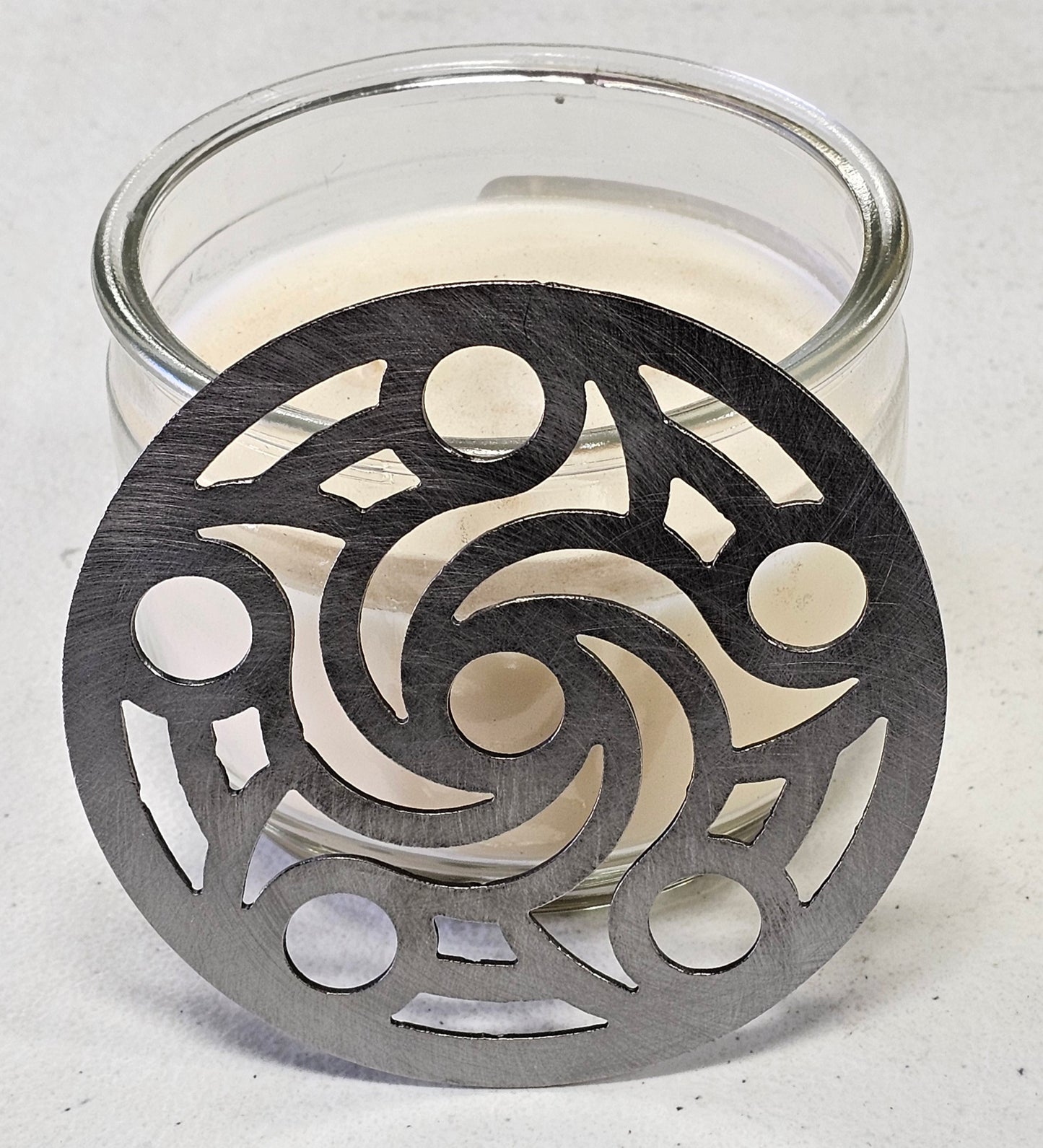 Metal candle topper helping prevent candle tunneling