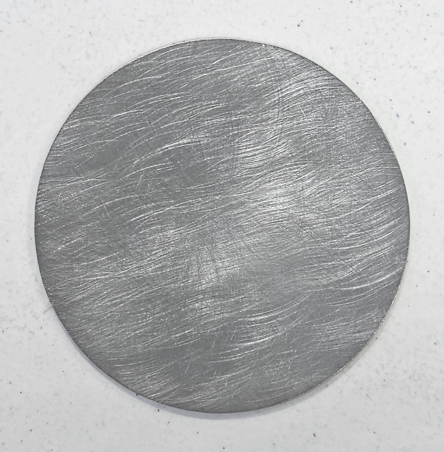 flat metal candle snuffer lid on jar candle