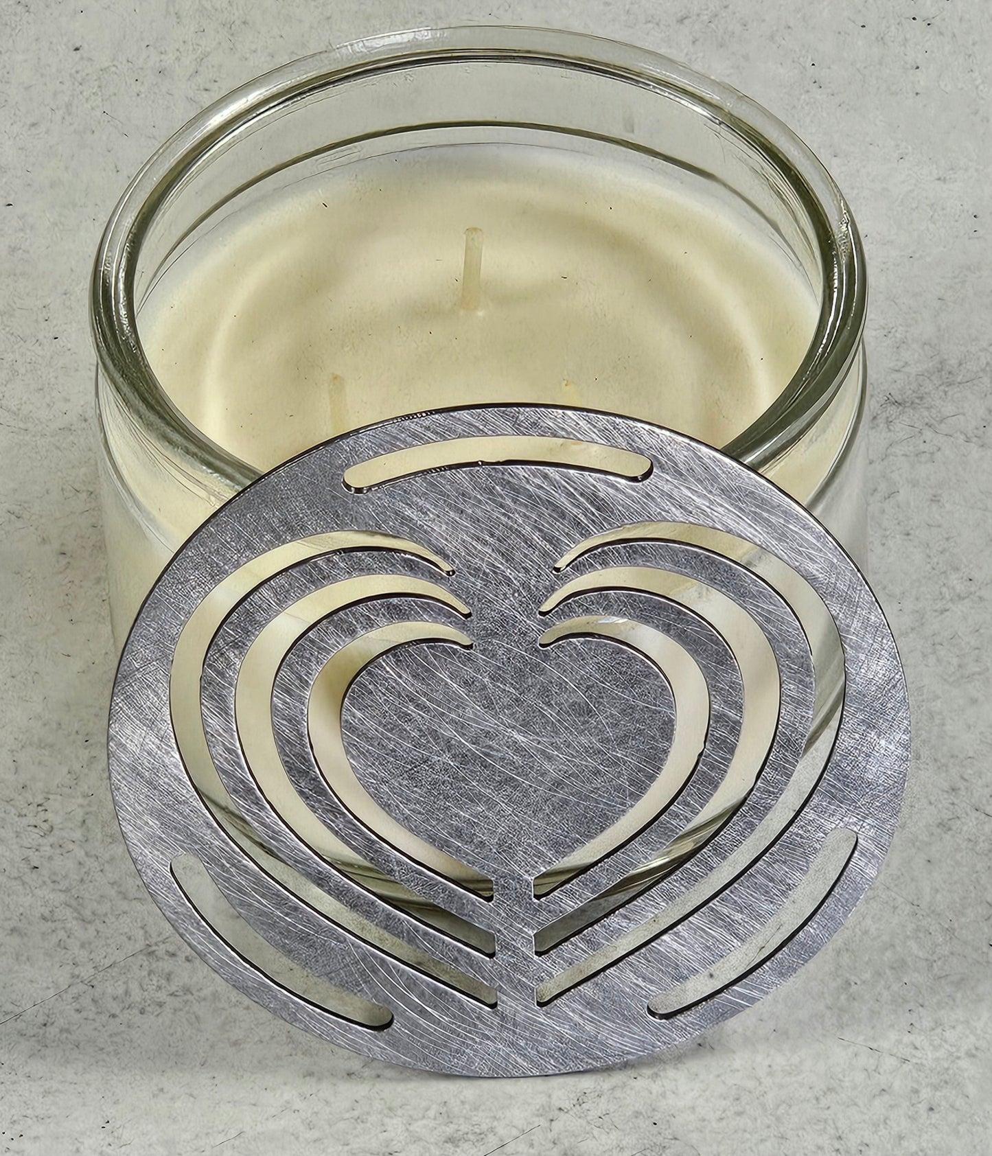 Layered Heart Candle Topper on a white jar candle featuring an elegant decorative metal heart design.