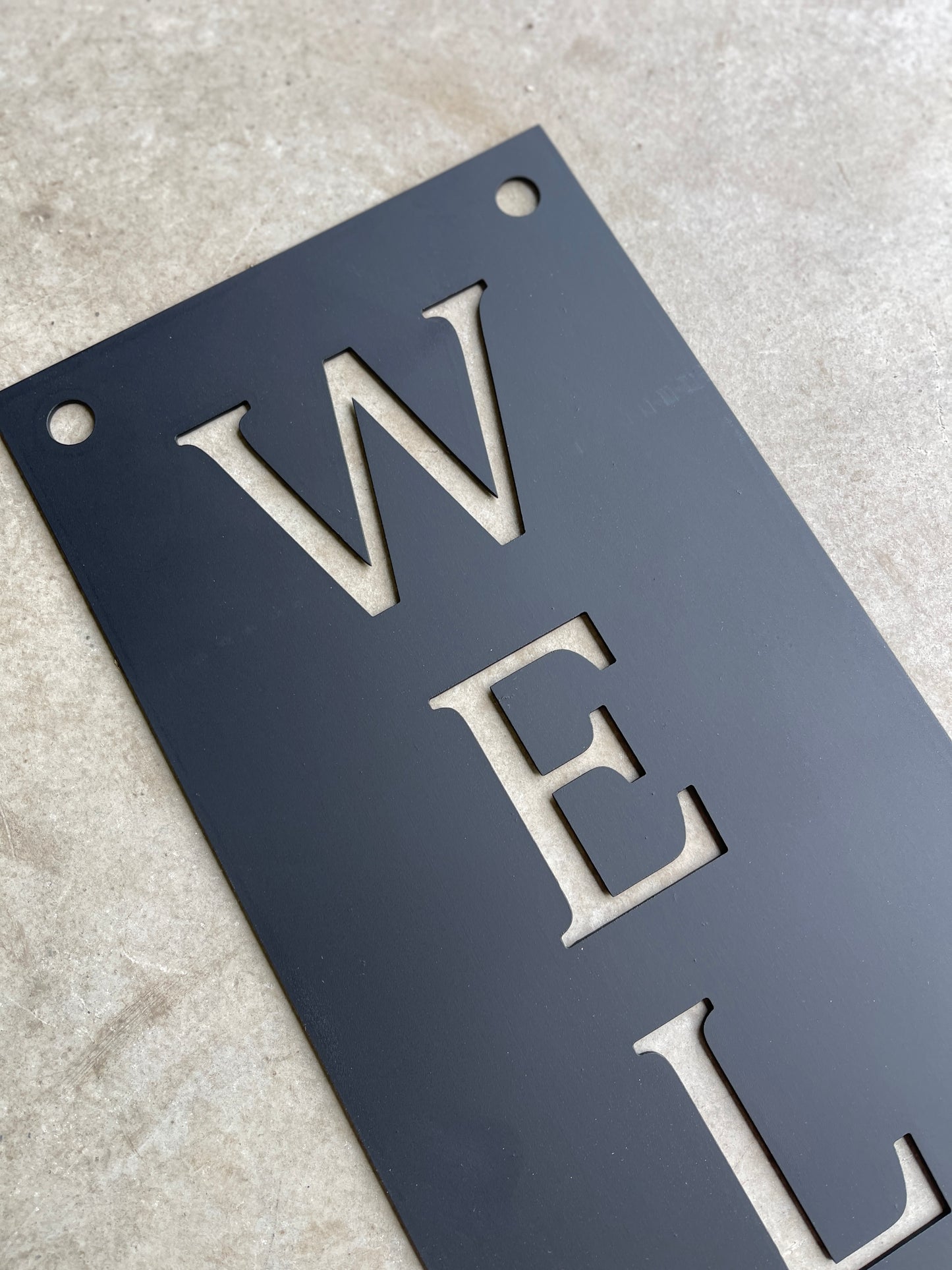 Black Welcome Sign
