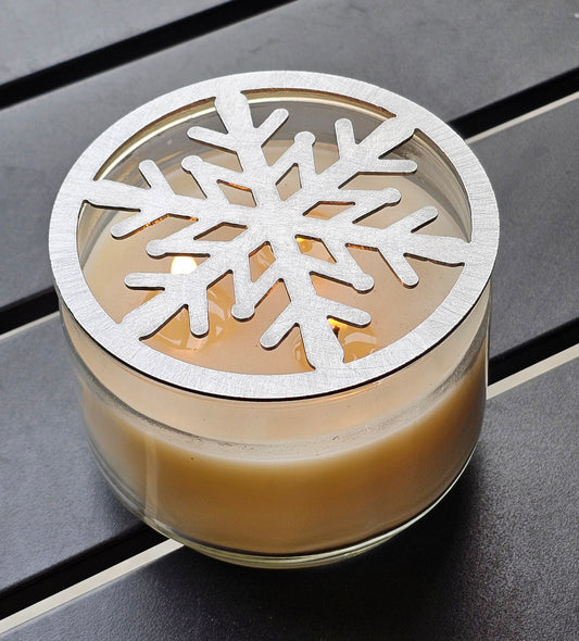 Metal snowflake candle topper on jar candle for Christmas decor