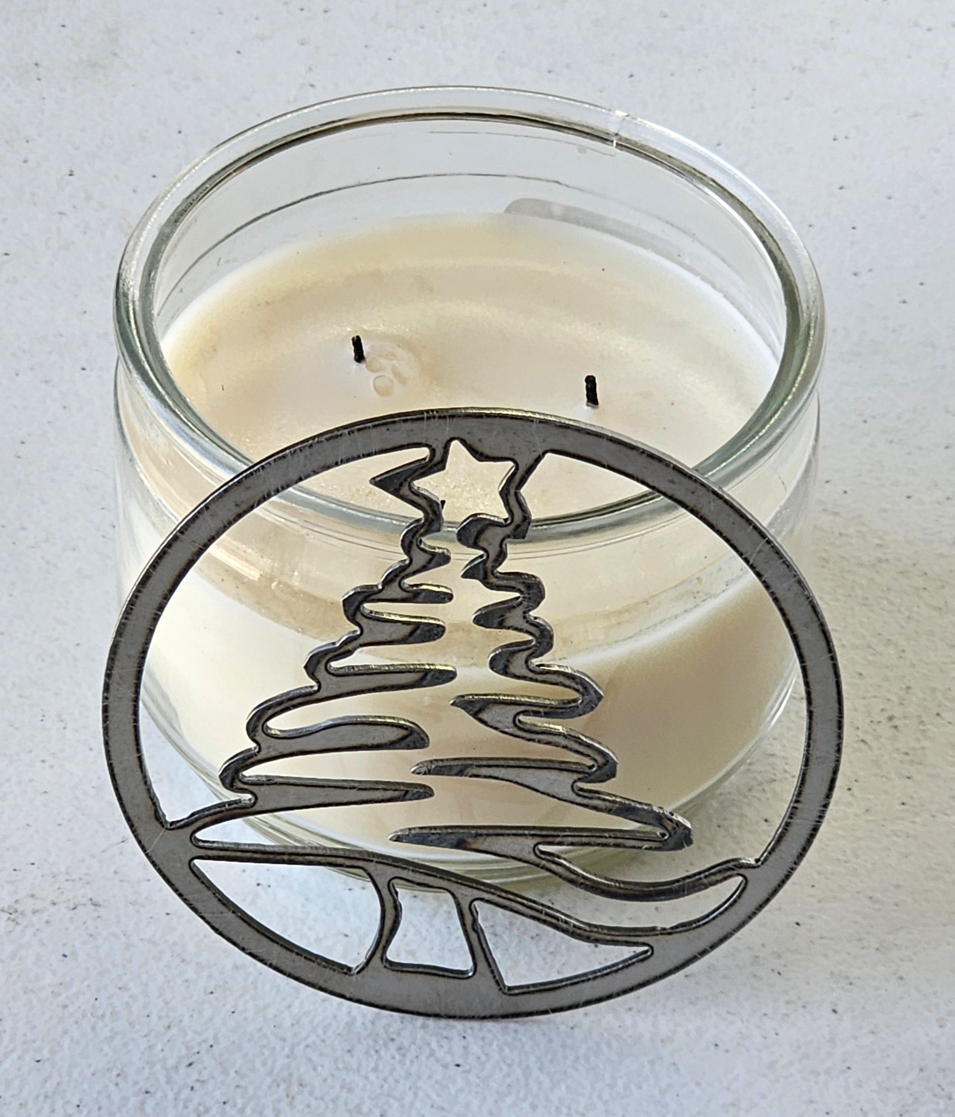 Holiday candle topper with tree silhouette design
