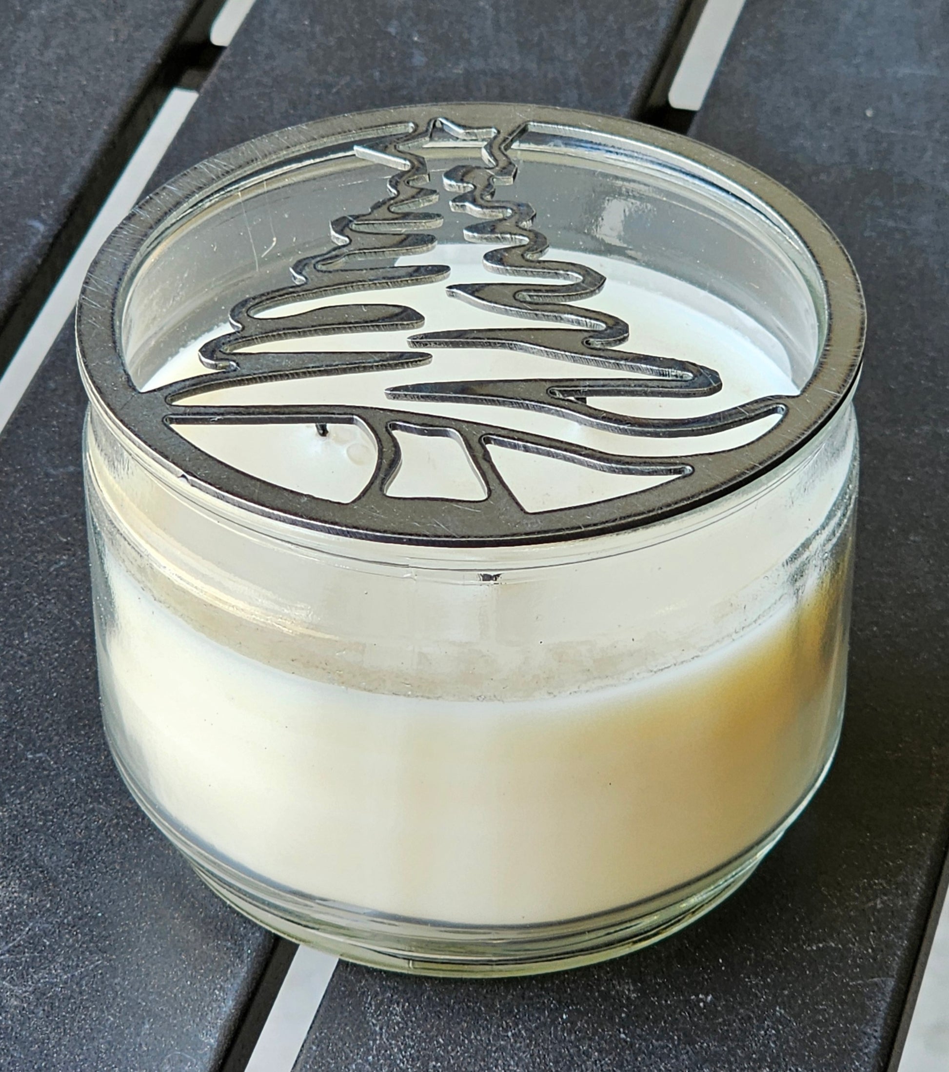 Festive metal jar candle topper for even burn