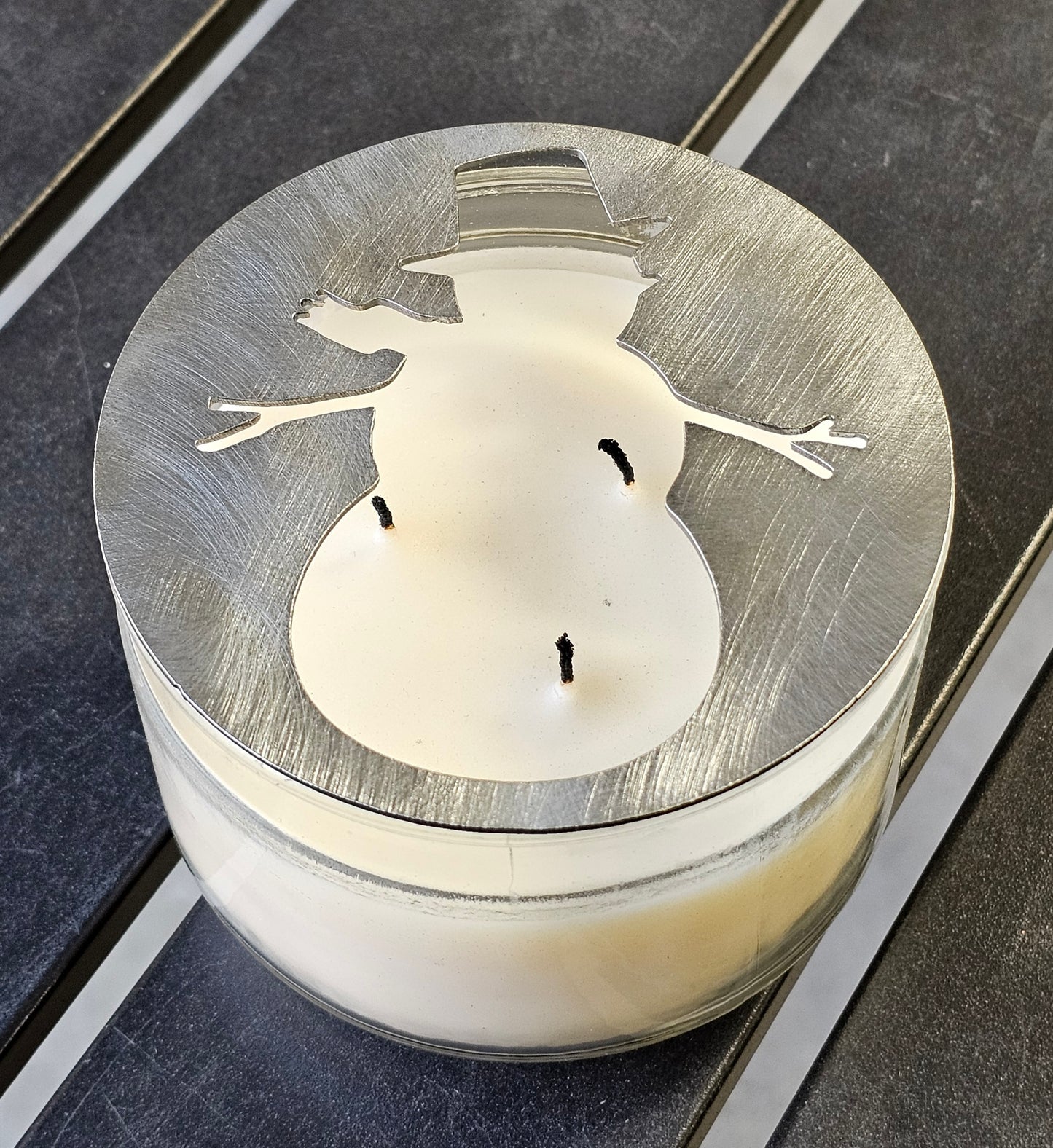 Christmas candle topper with snowman cutout metal lid