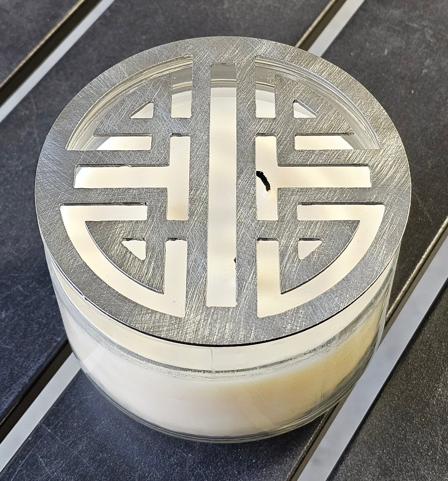 Double Happiness Glow candle topper in black ceramic finish on a candle