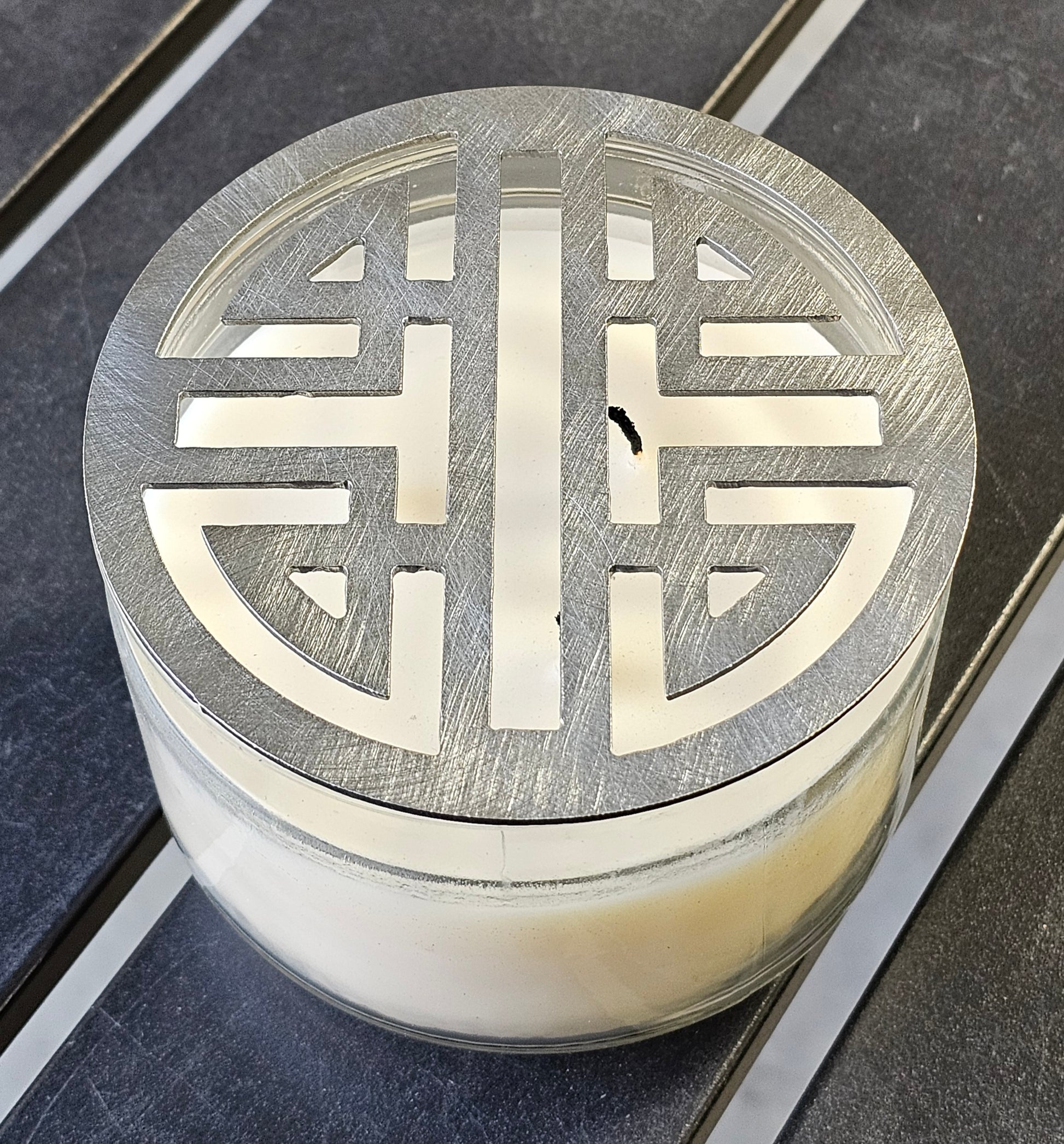 Double Happiness Glow candle topper in black ceramic finish on a candle