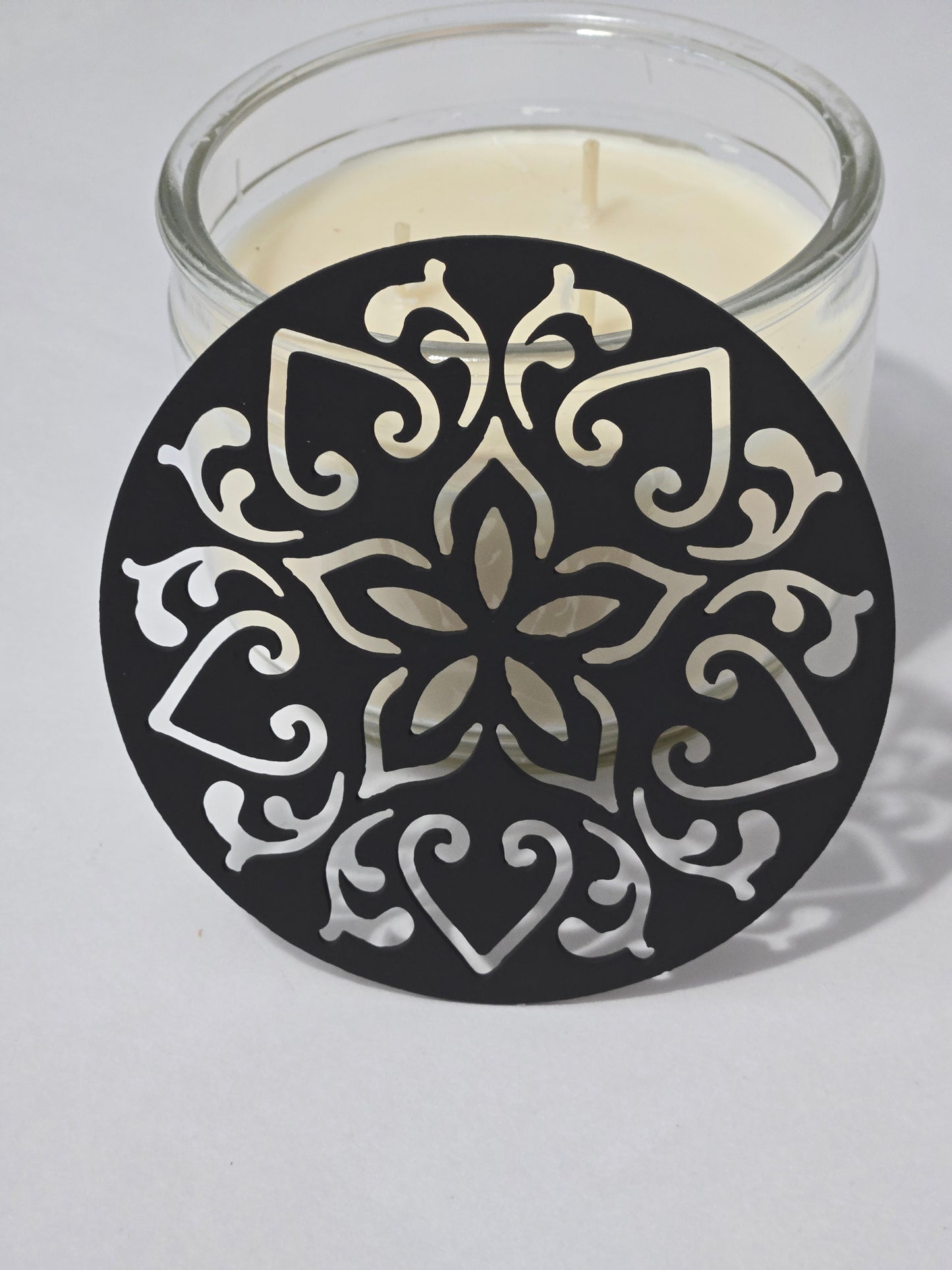 Ornate metal candle flame guard