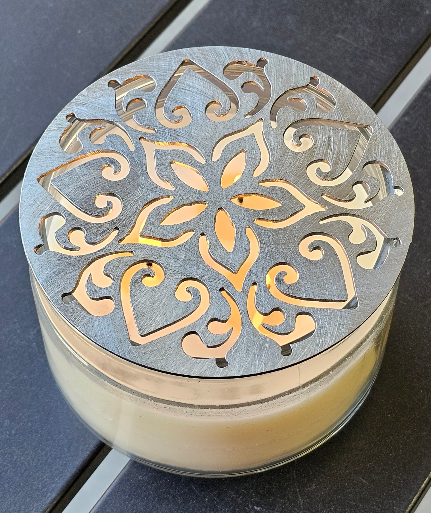 Metal floral star candle topper on jar candle for farmhouse decor