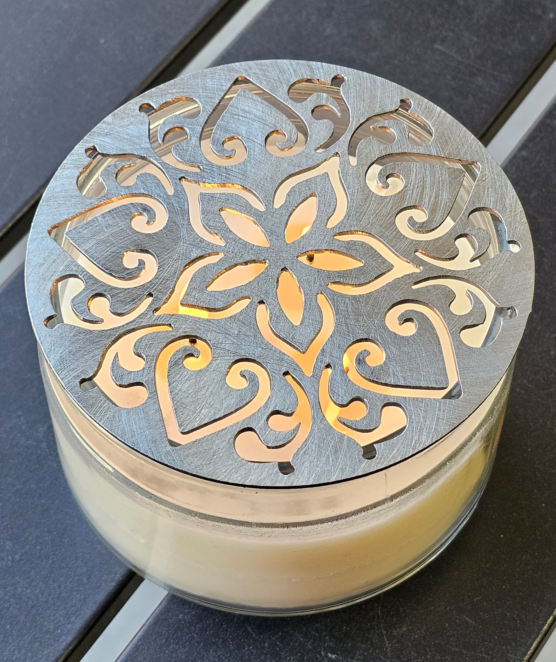 Metal floral star candle topper on jar candle for farmhouse decor