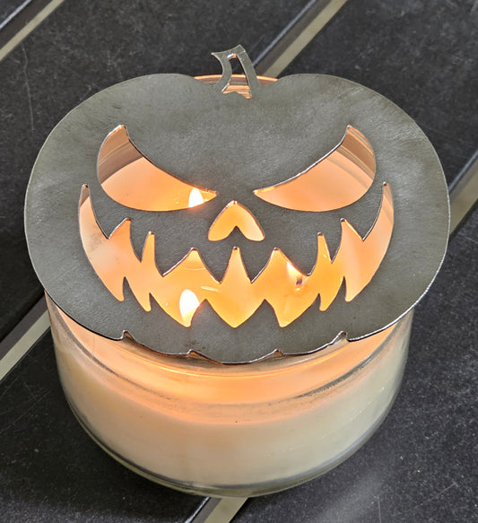 “Metal jack o lantern candle topper on jar candle for Halloween decor