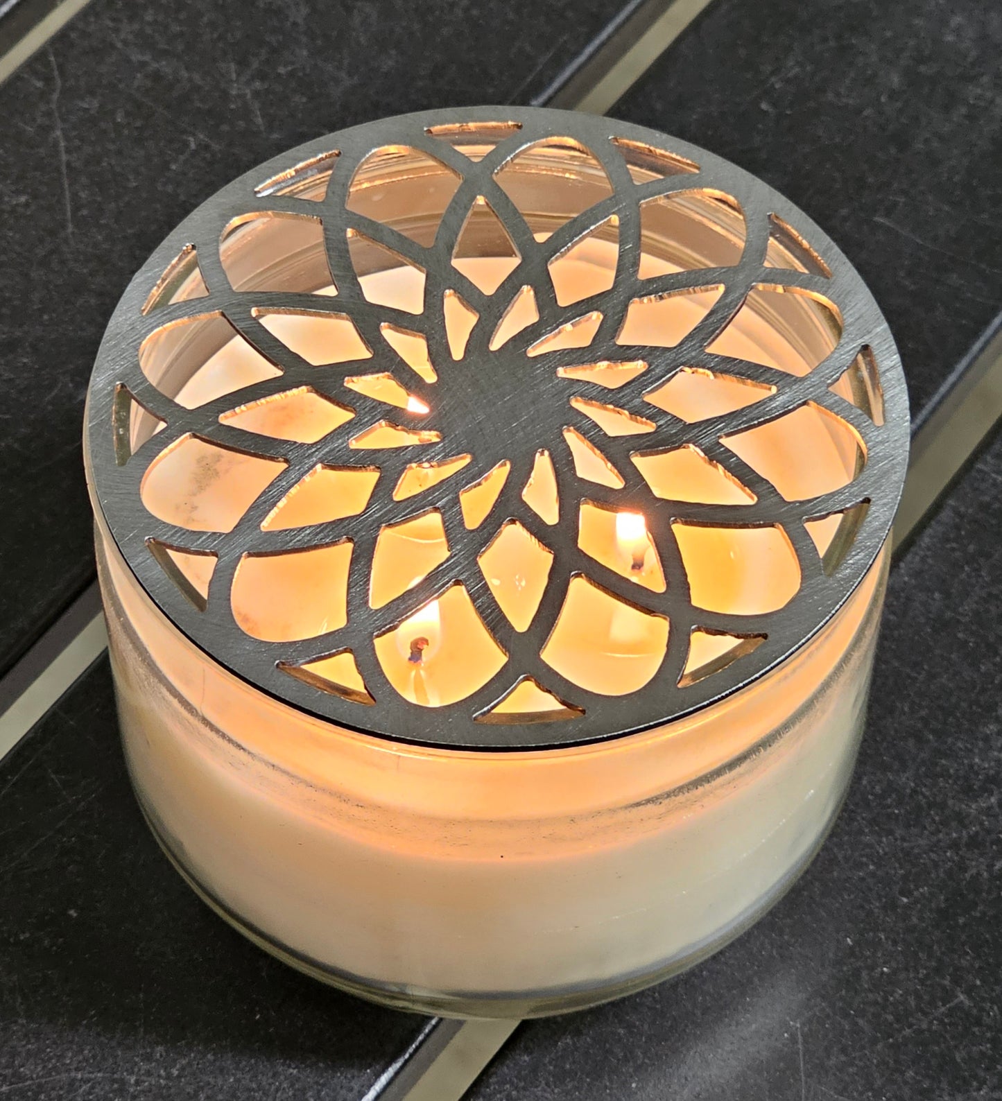 Gilded rosette metal candle topper on jar candle for vintage decor