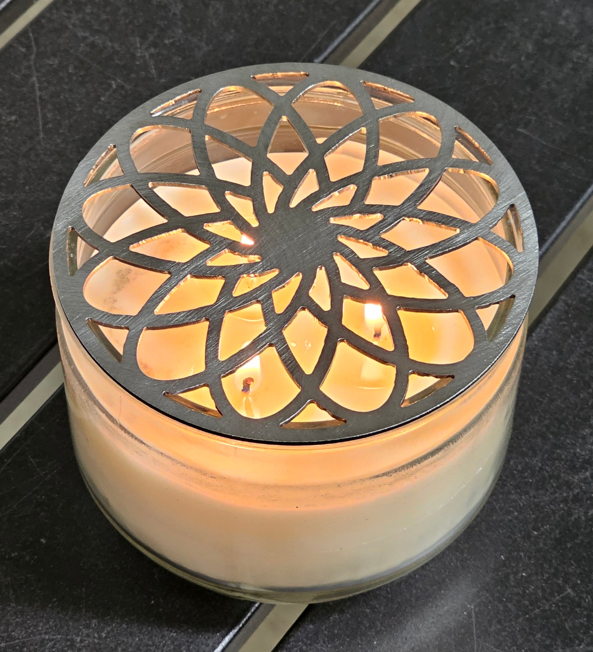 Gilded rosette metal candle topper on jar candle for vintage decor