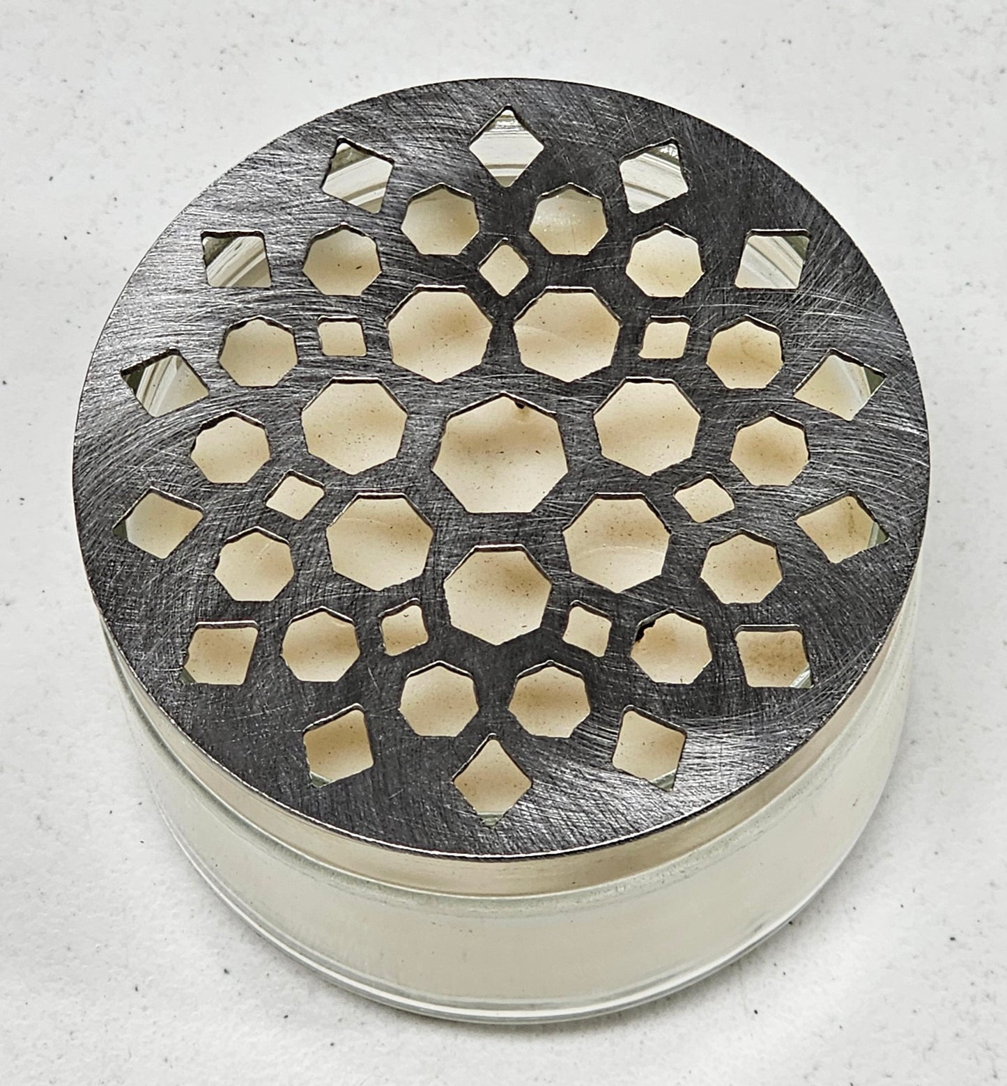 Geometric metal candle topper with Moroccan mandala constellation design