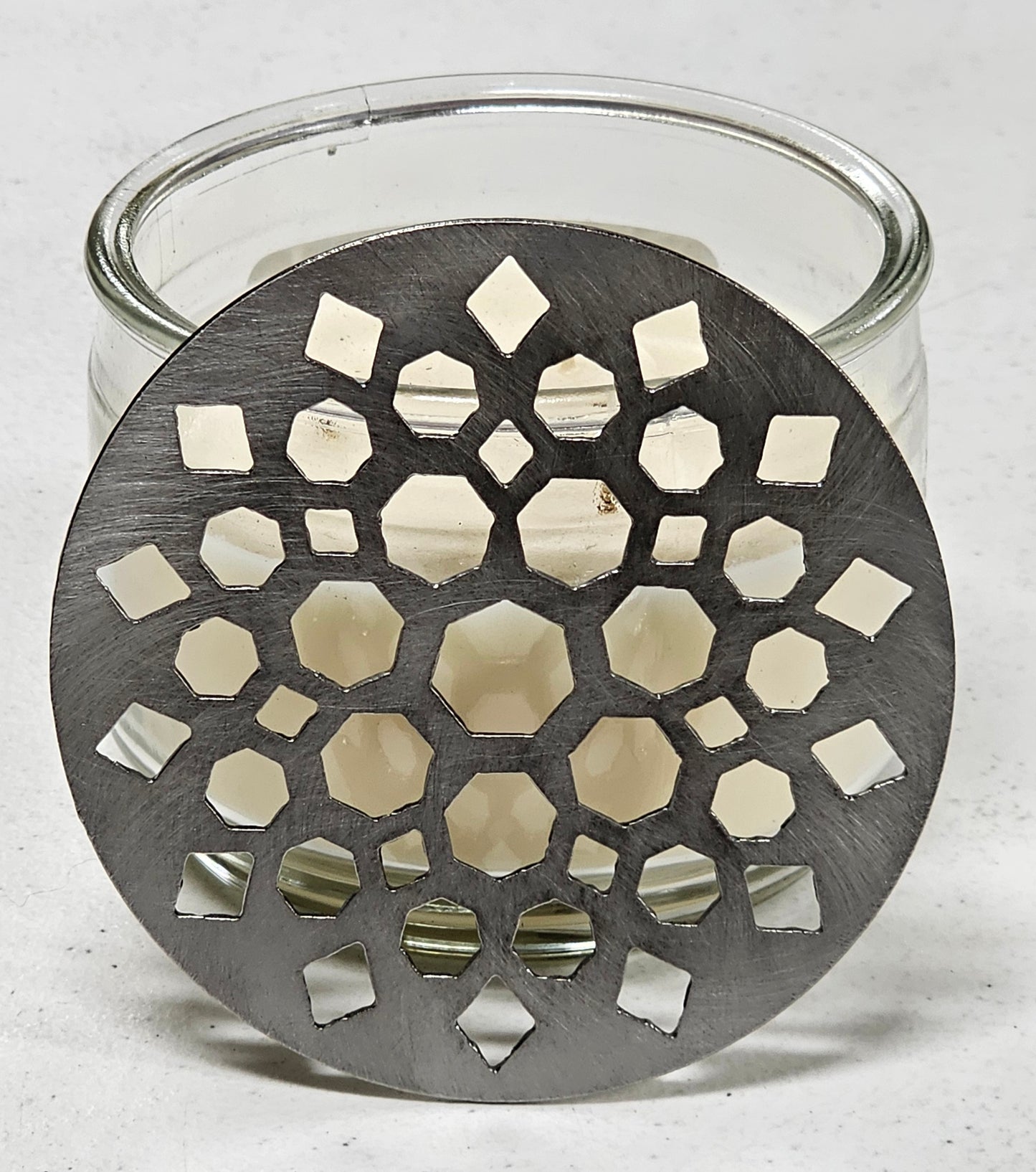 Geometric metal candle topper with Moroccan mandala constellation design