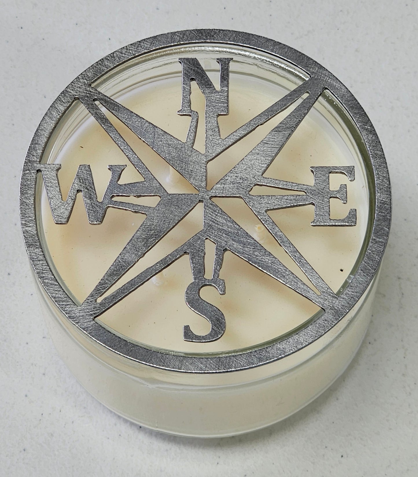 Metal nautical compass rose candle topper on jar candle