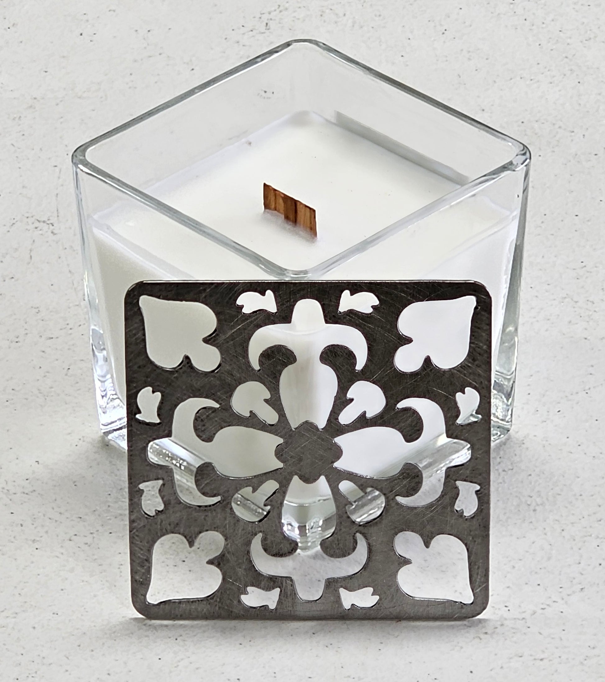 Metal scrollwork candle topper close up detail