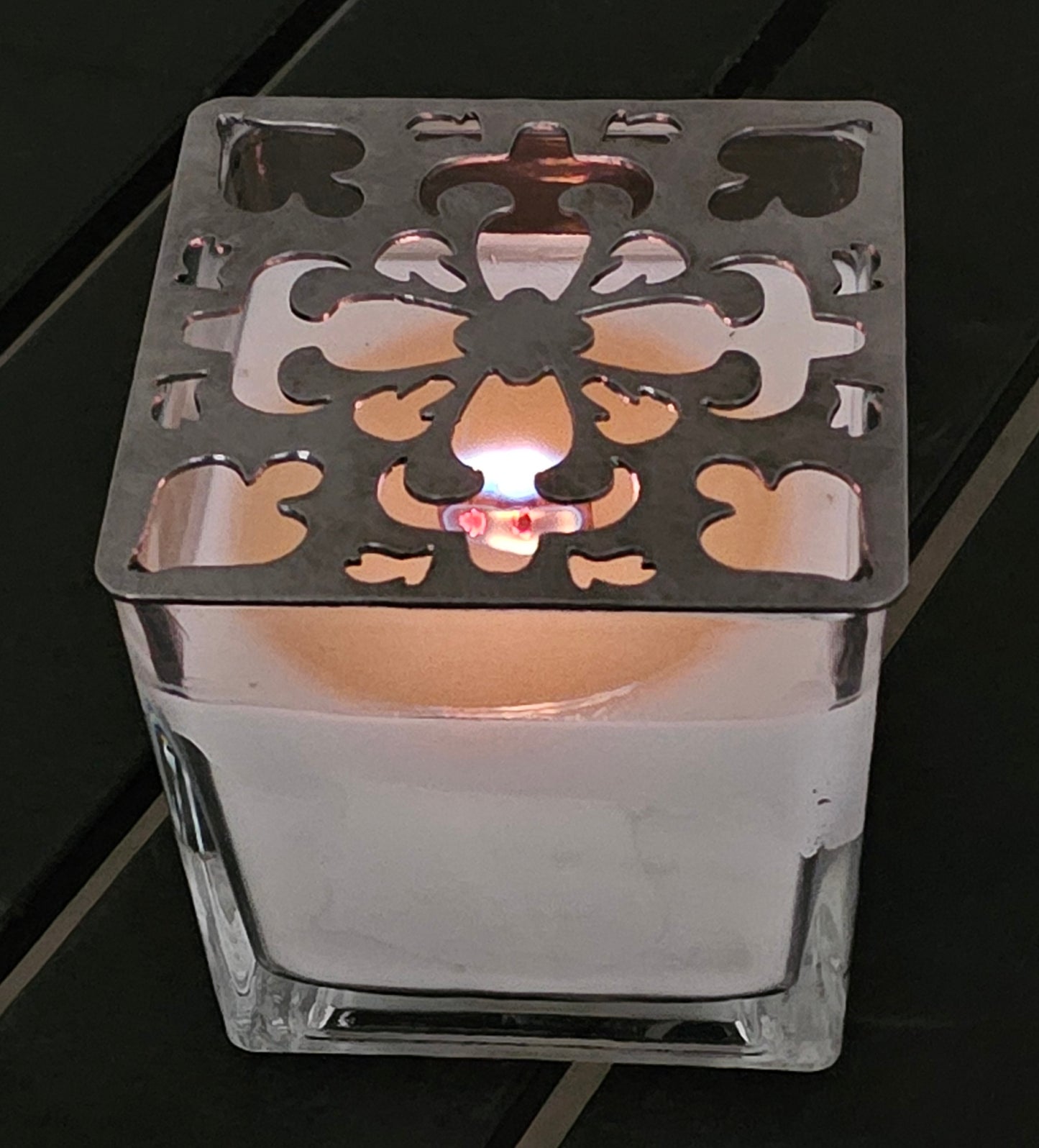 Artisan Arabesque metal candle topper on white jar candle