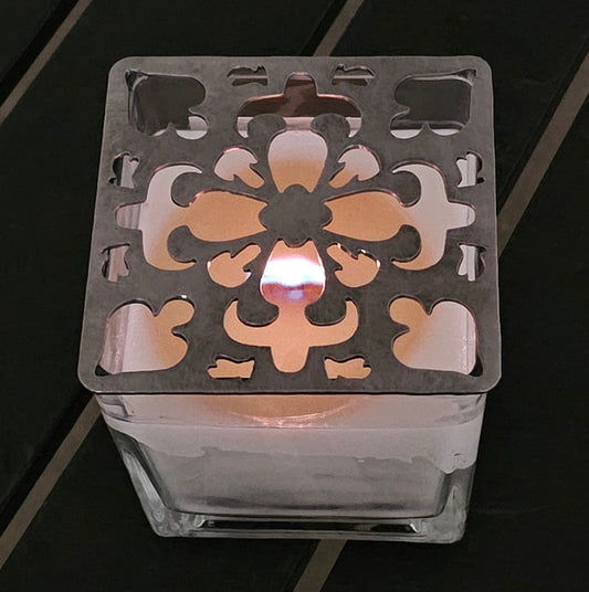 Artisan Arabesque metal candle topper on white jar candle