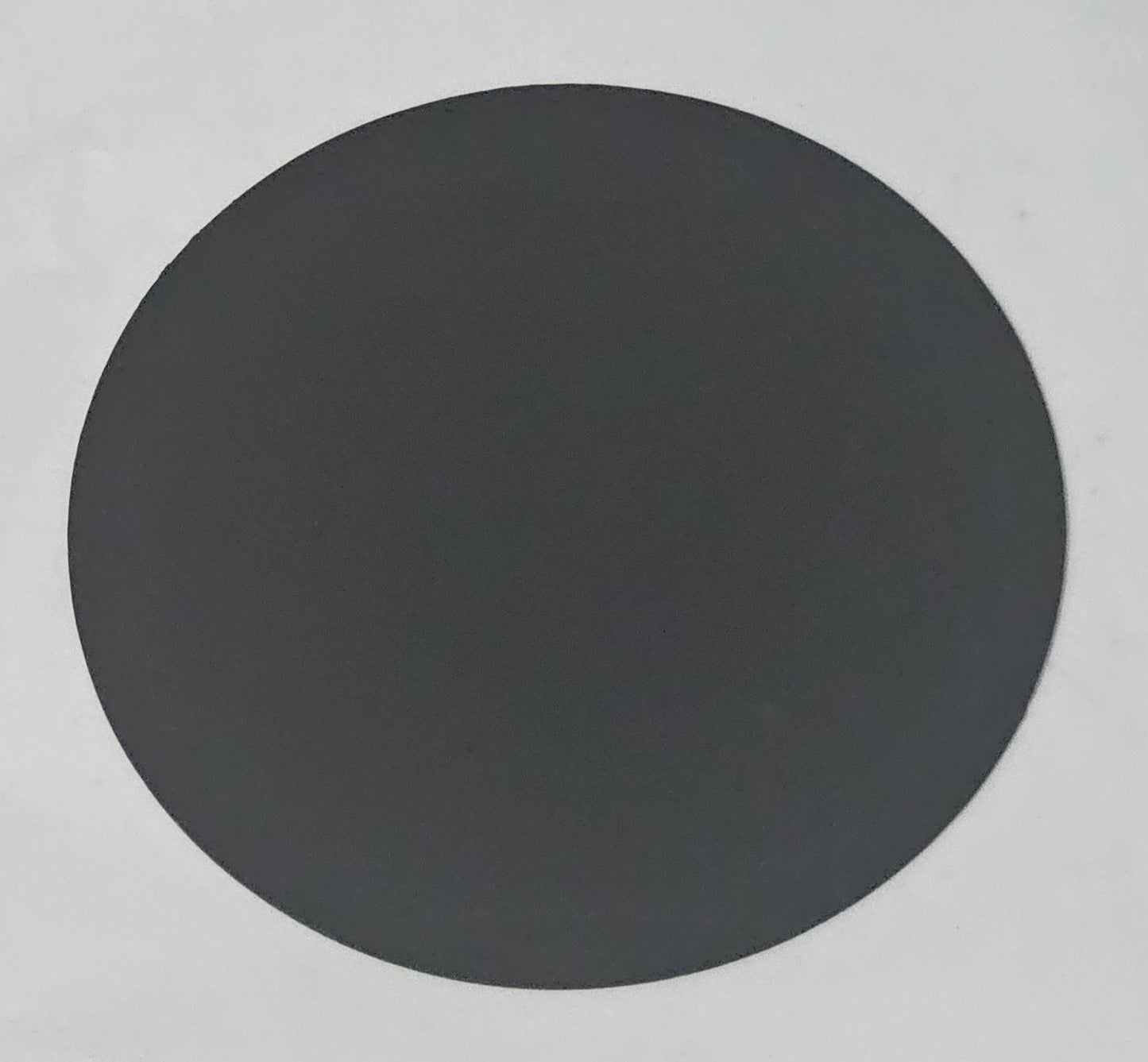 flat metal candle snuffer lid on jar candle