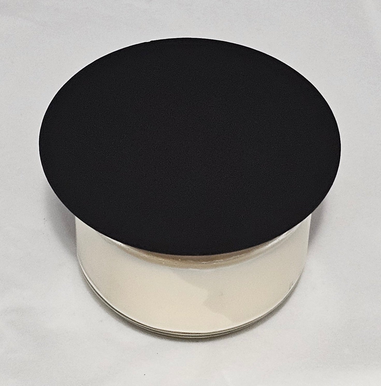 candle extinguisher lid covering flame