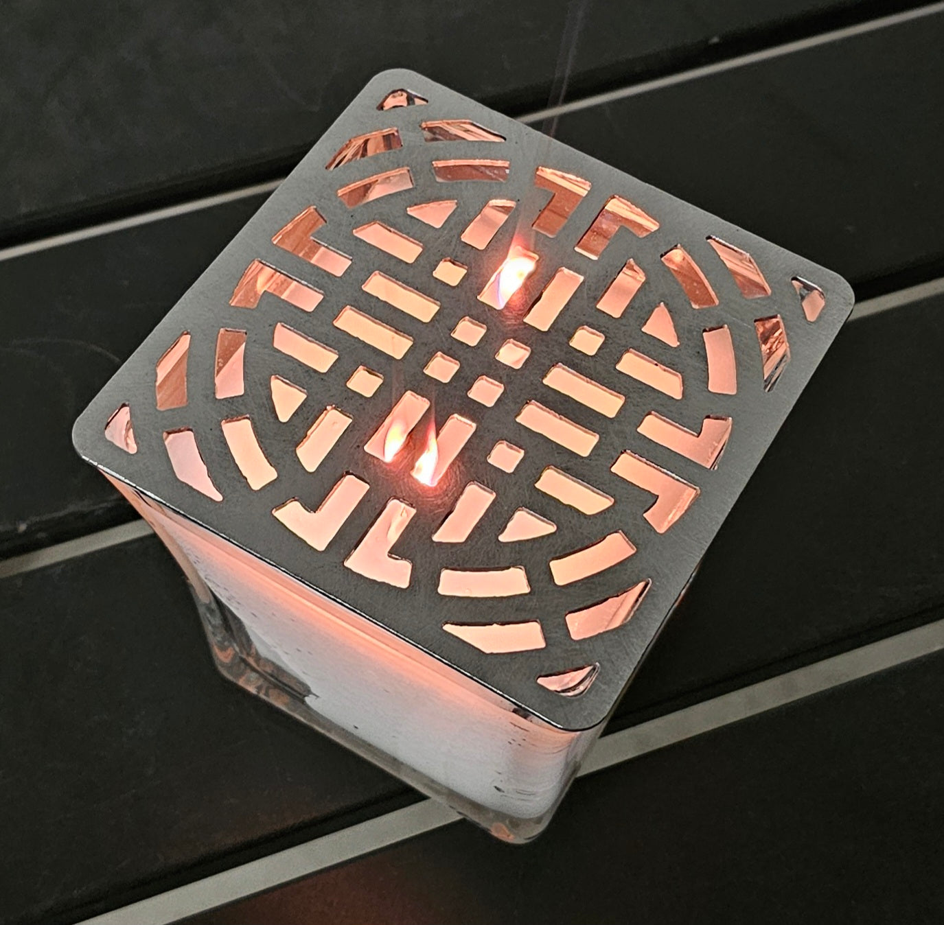 candle topper creating ambient light pattern