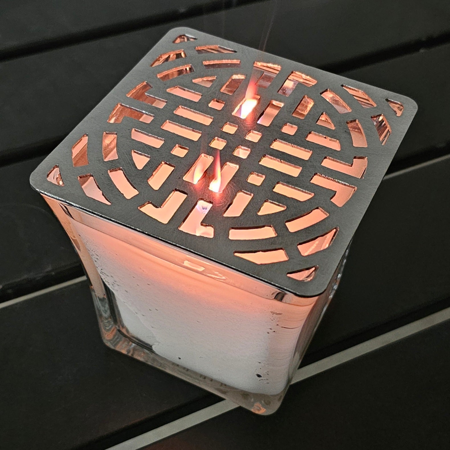 candle topper creating ambient light pattern