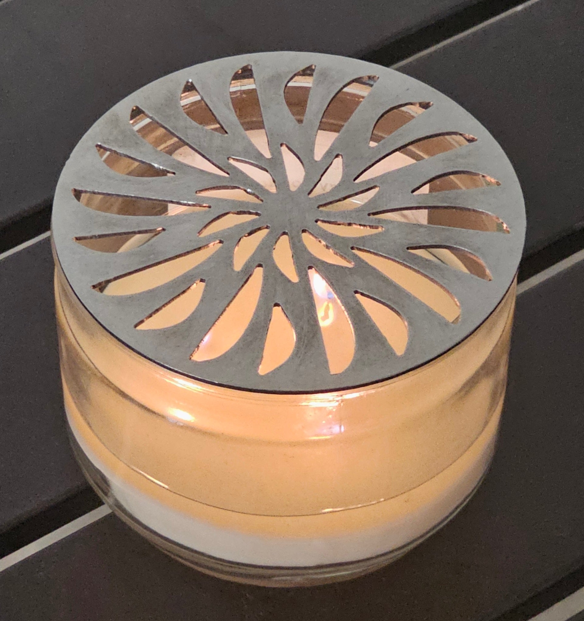 radiant pinwheel candle topper metal floral design