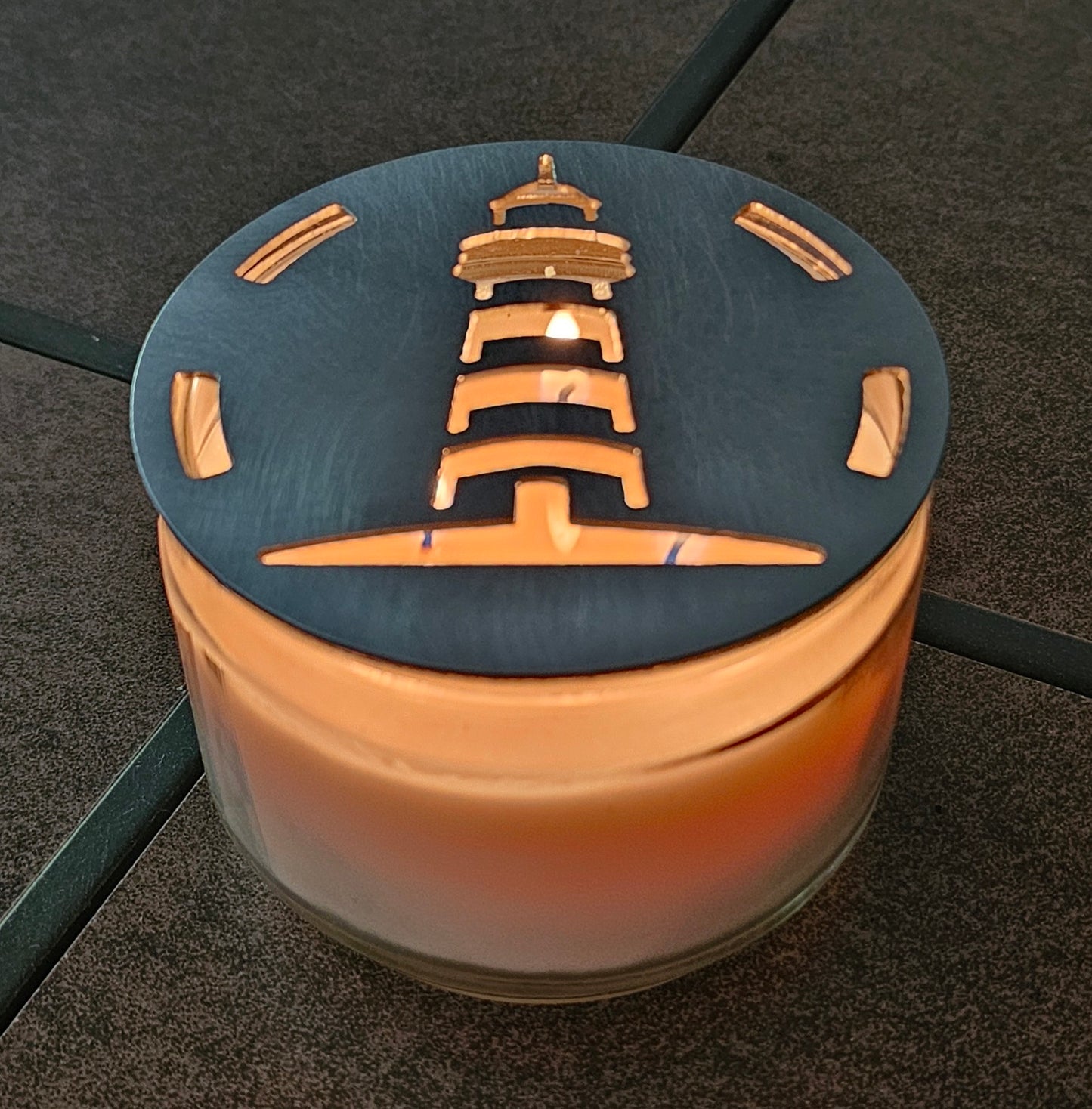 Nautical metal candle topper glowing