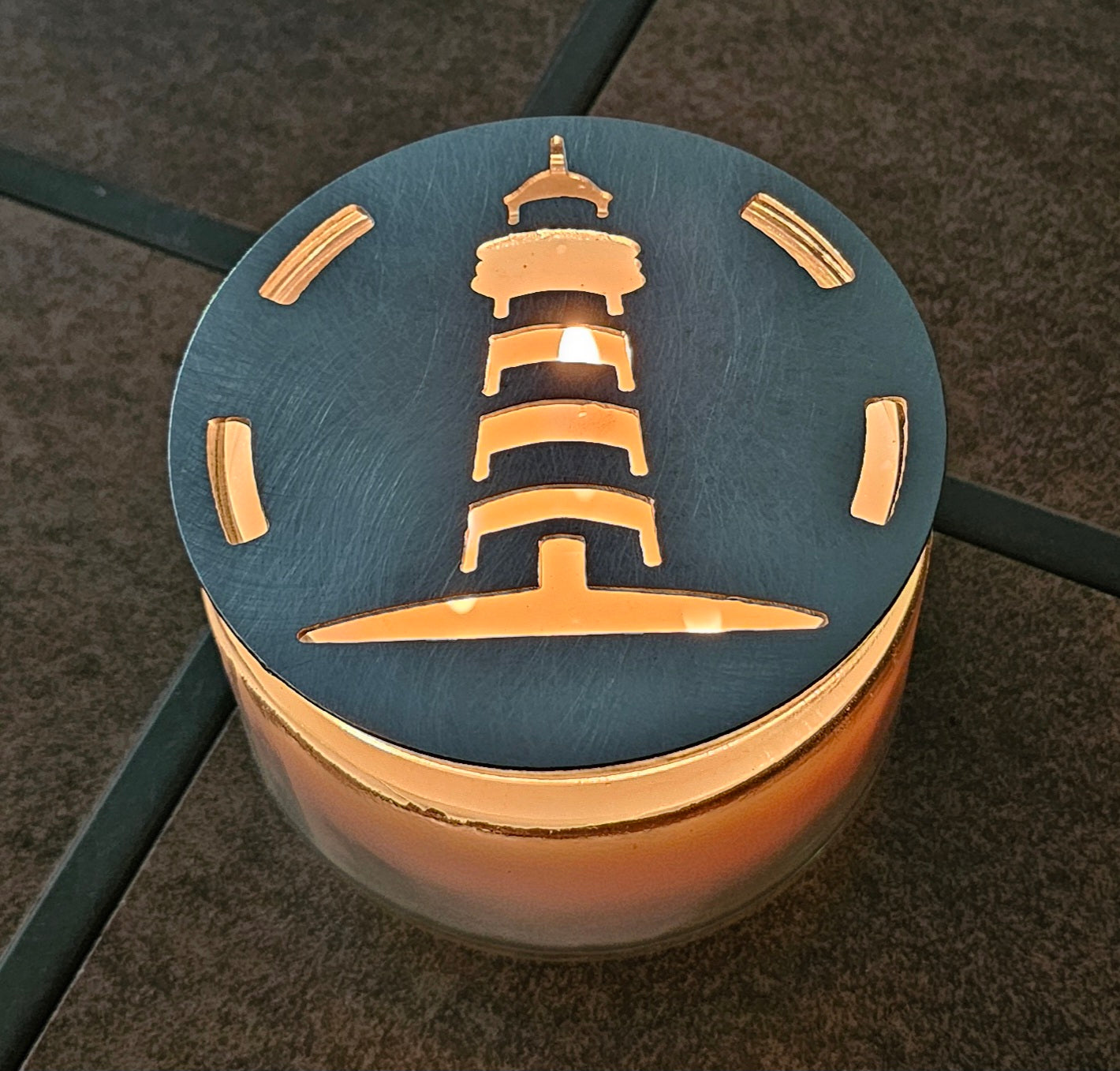 Nautical metal candle topper glowing