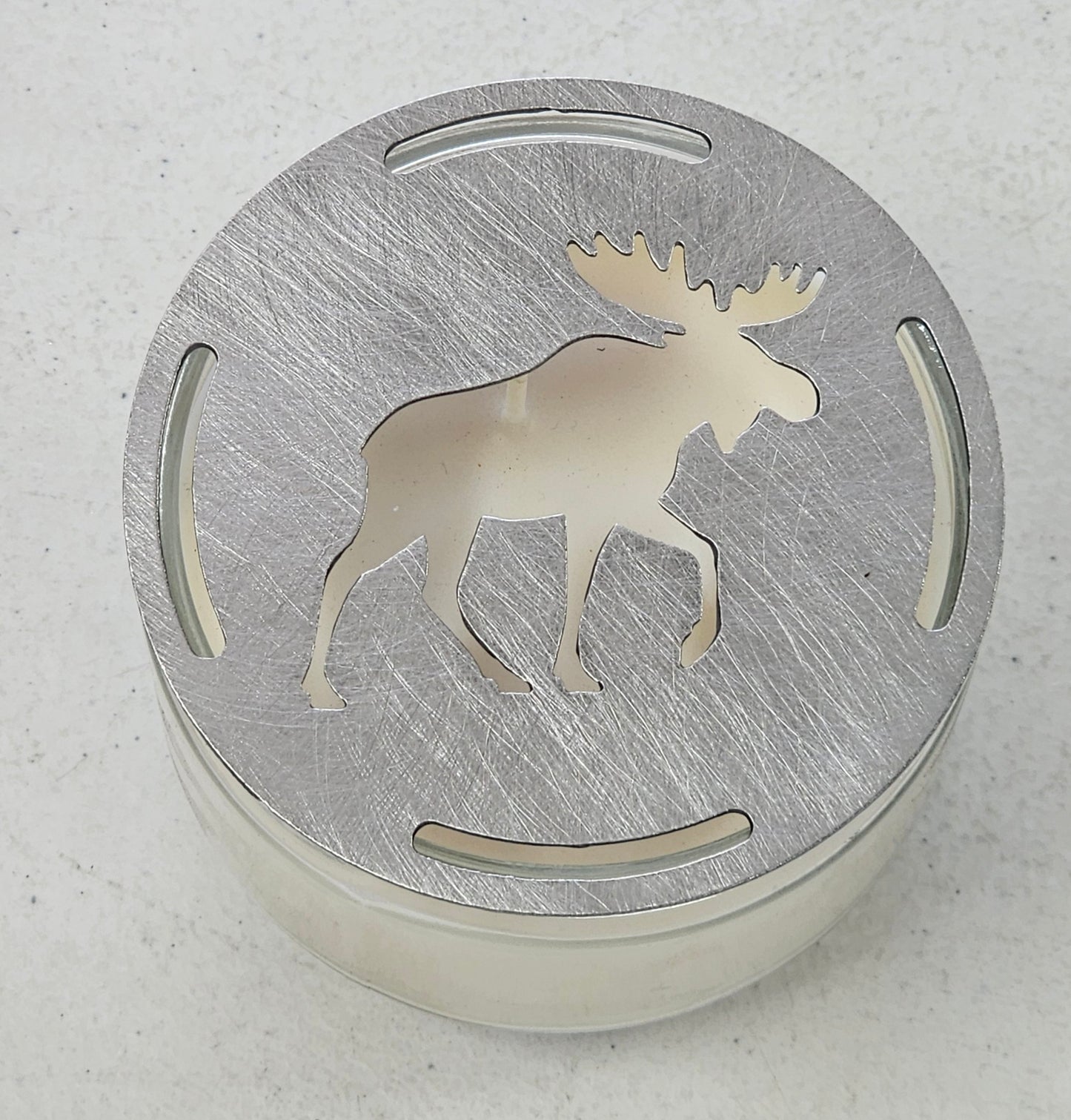 Flat metal moose candle topper on jar candle, rustic woodland candle accessory