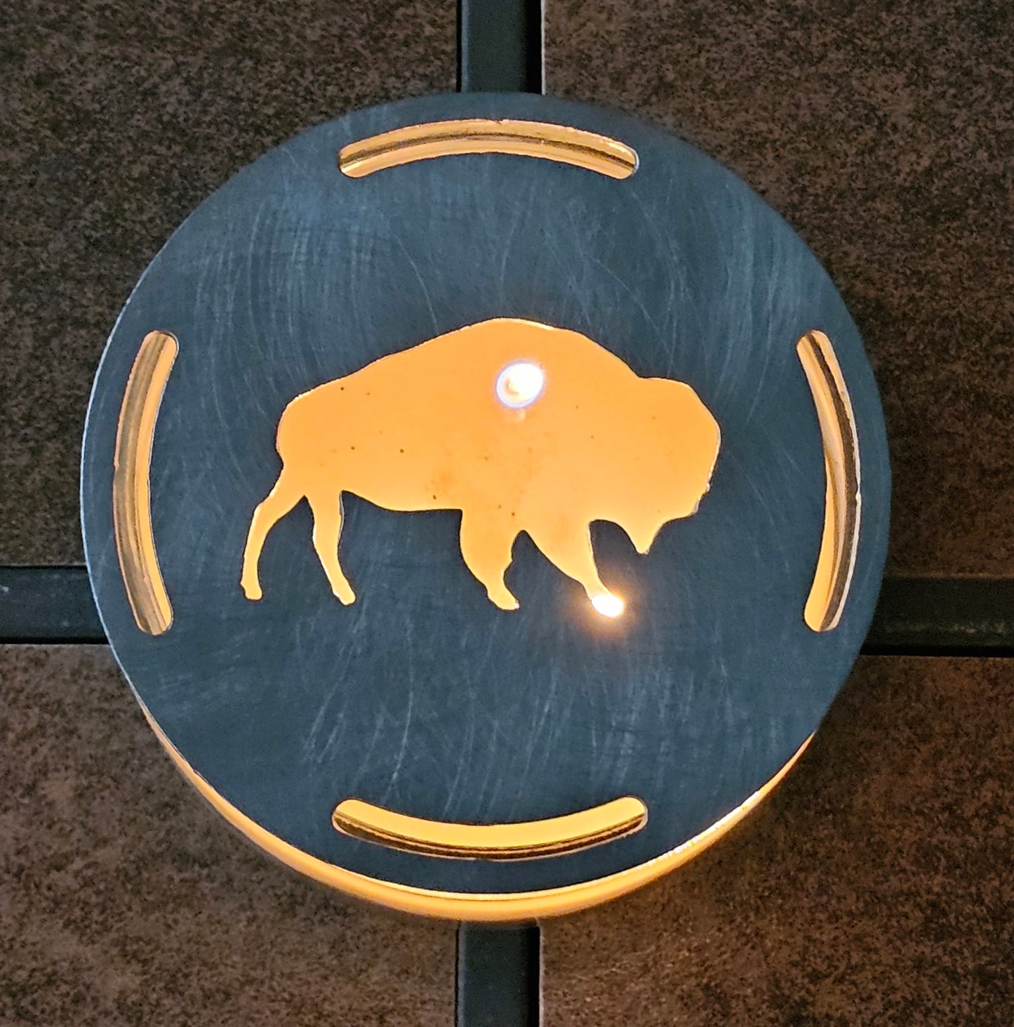  Buffalo candle topper on lit jar candle glowing with bison silhouette