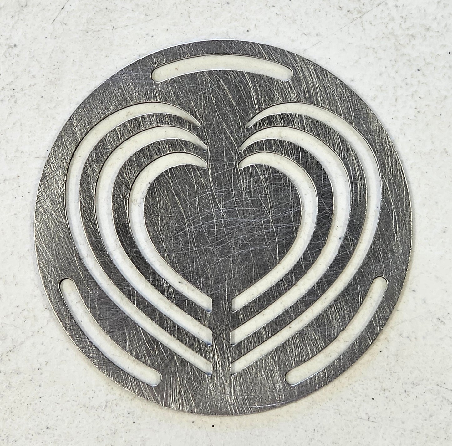 Decorative metal Layered Heart Candle Topper viewed from above