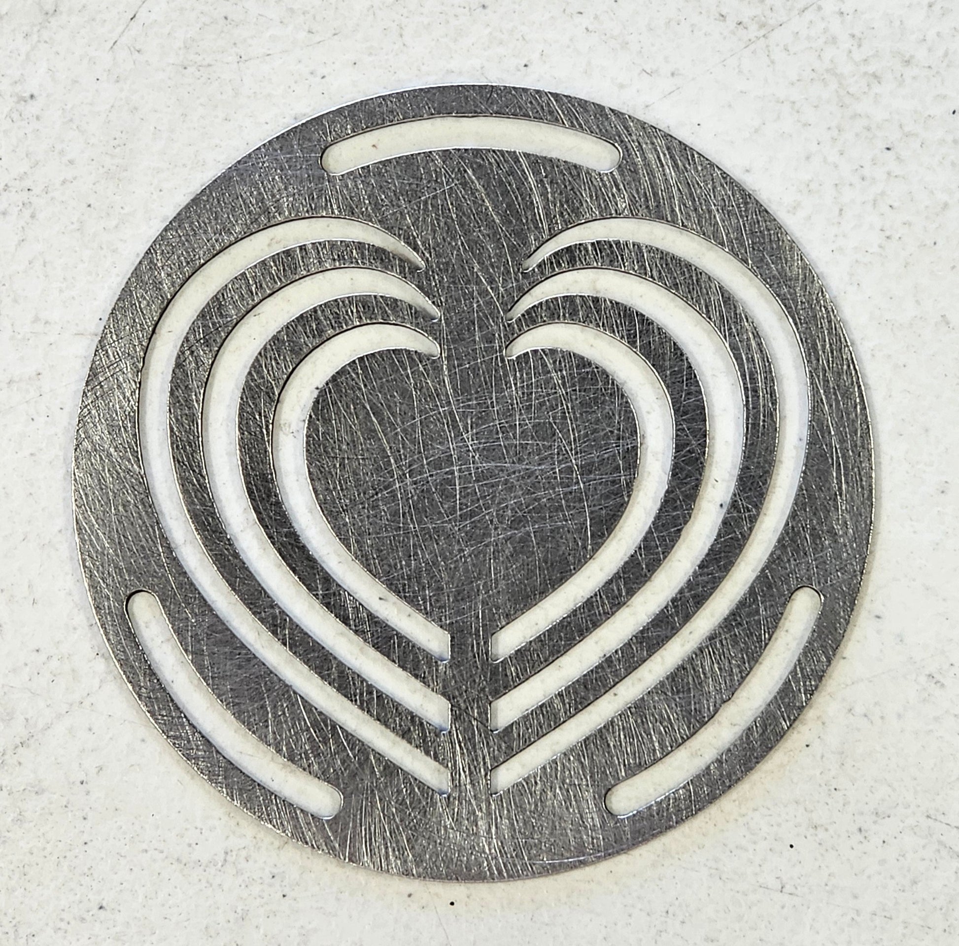 Decorative metal Layered Heart Candle Topper viewed from above