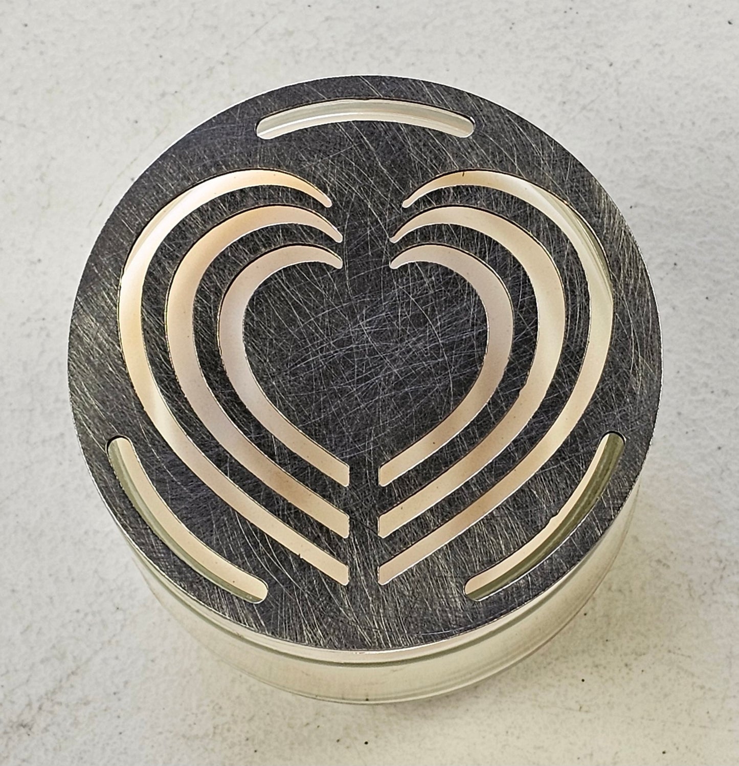 Decorative metal Layered Heart Candle Topper viewed from above