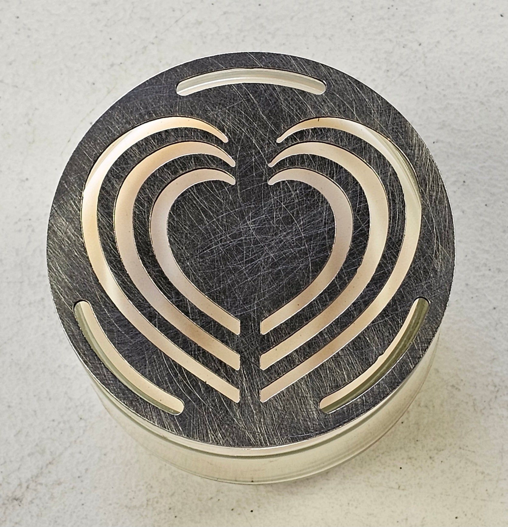 Decorative metal Layered Heart Candle Topper viewed from above