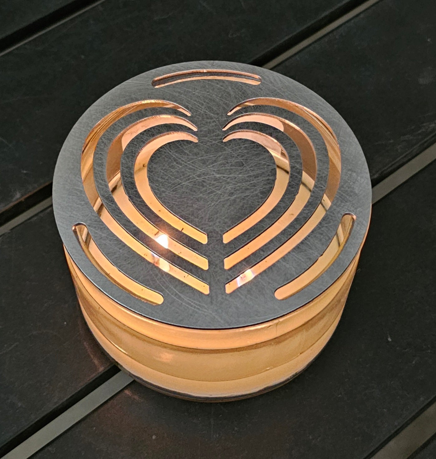 Layered Heart Candle Topper on a white jar candle featuring an elegant decorative metal heart design.