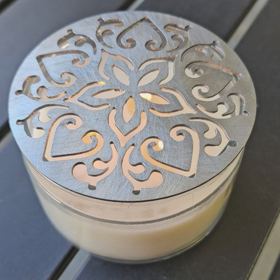 Ornate metal candle flame guard