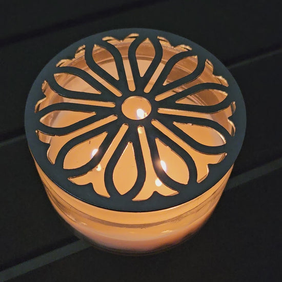 candle topper glowing on lit candle
