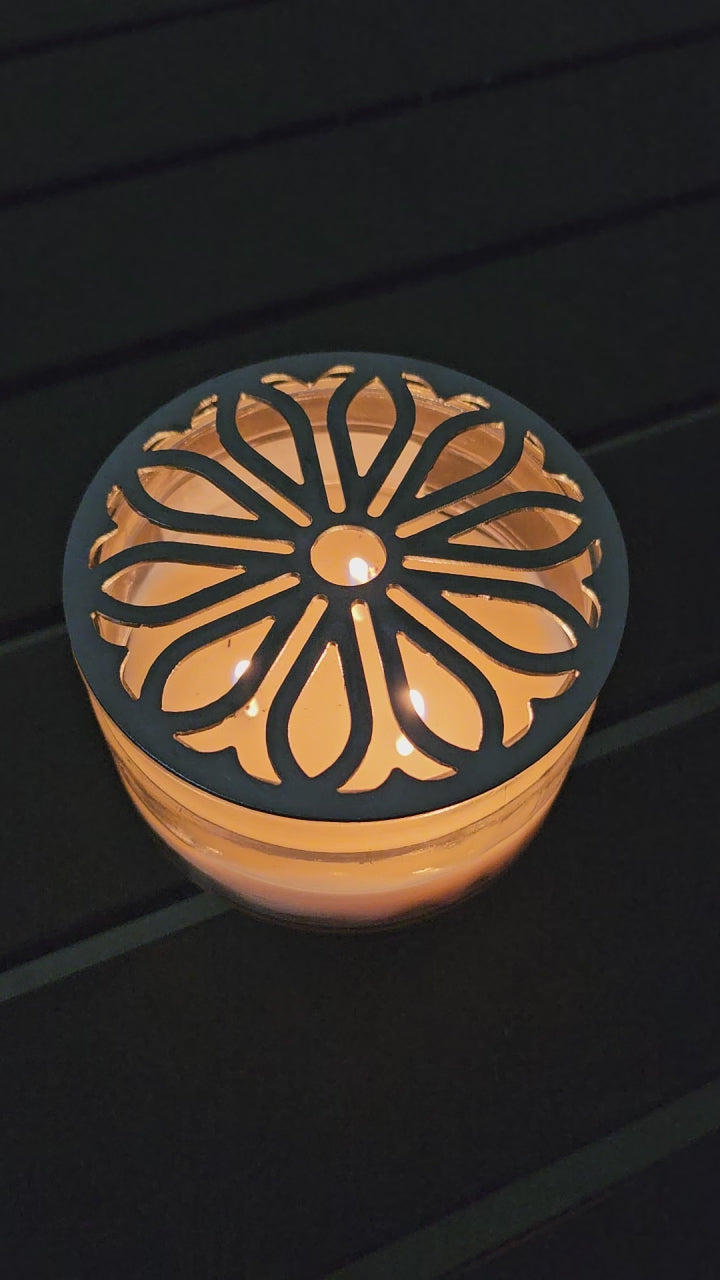 candle topper glowing on lit candle