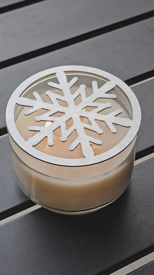 Metal snowflake candle topper on jar candle for Christmas decor