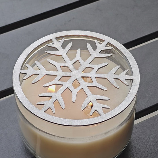 Frosted metal snowflake candle topper on jar candle for Christmas decor