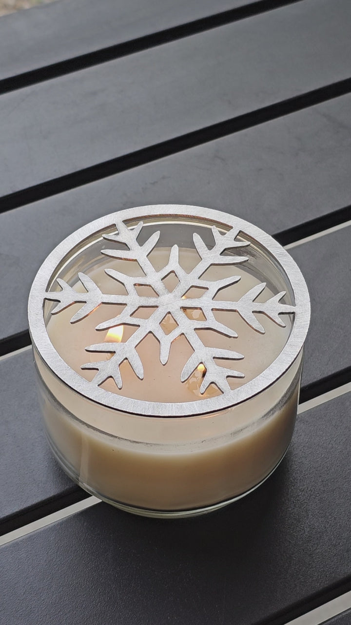 Frosted metal snowflake candle topper on jar candle for Christmas decor