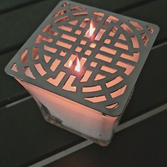 candle topper creating ambient light pattern