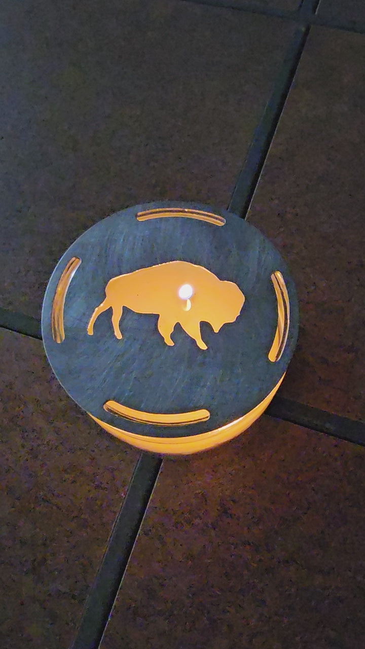  Buffalo candle topper on lit jar candle glowing with bison silhouette