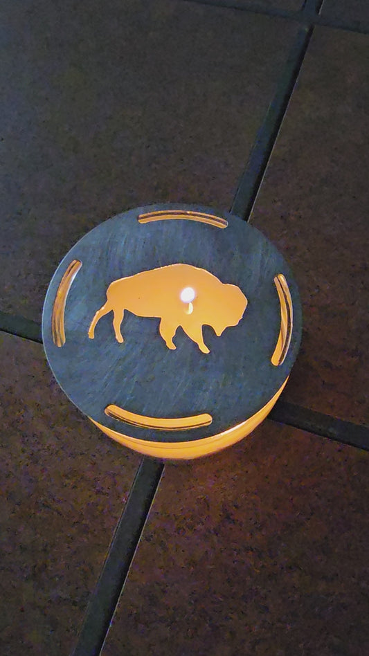  Buffalo candle topper on lit jar candle glowing with bison silhouette