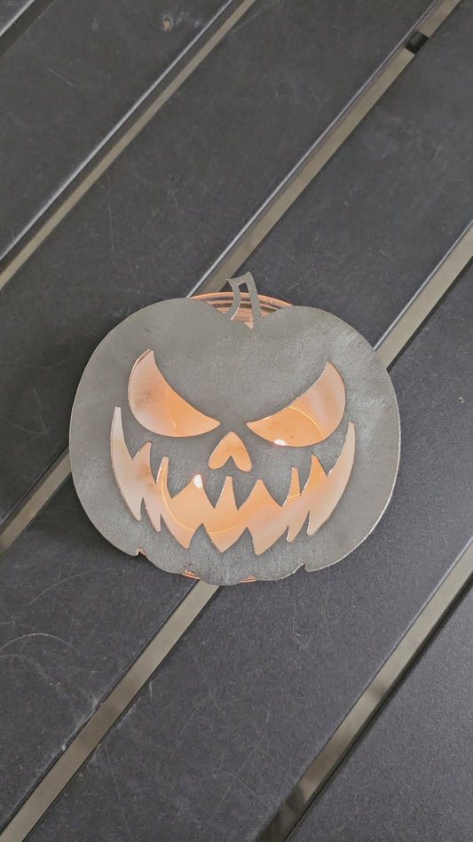 “Metal jack o lantern candle topper on jar candle for Halloween decor