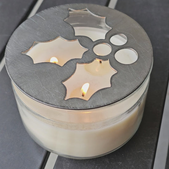 Mistletoe holly berry metal candle topper placed on white jar candle