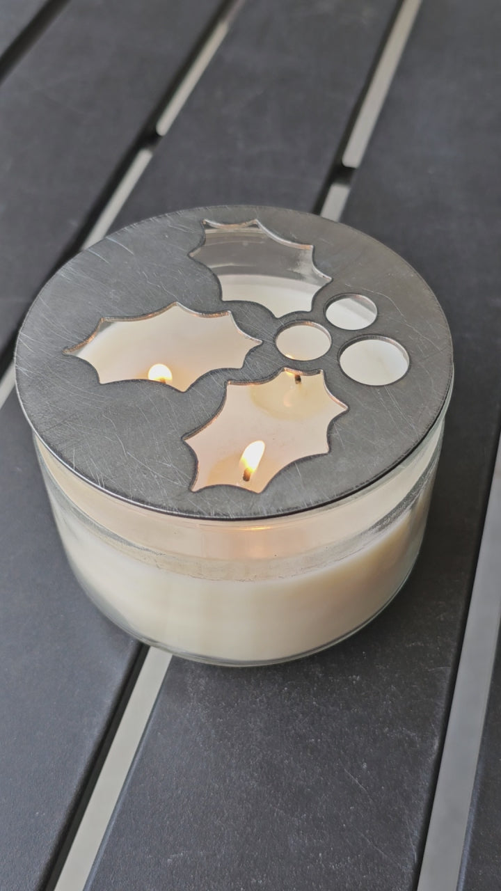Mistletoe holly berry metal candle topper placed on white jar candle